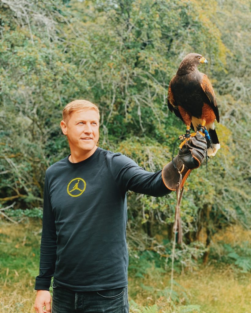 man holding a hawk